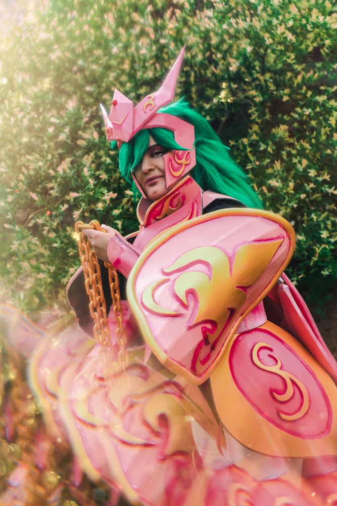 medium close-up of me in my andromeda shun god cloth from saint seiya, with a reflective effect in the foreground