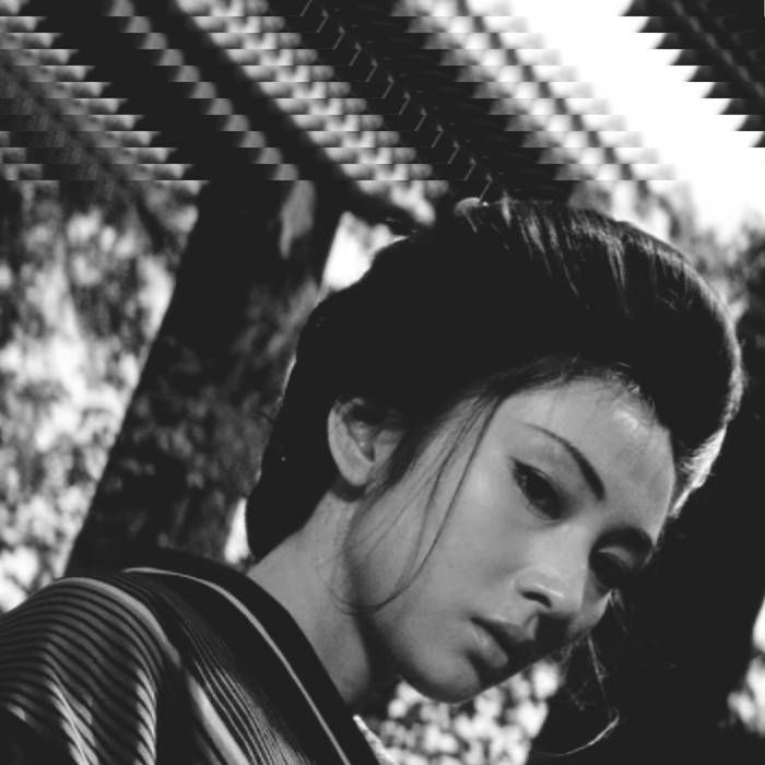 The cover art depicts what is presumably a still from a black-and-white film in which an East Asian woman is standing in a forest with a dramatic tilted camera angle. There is a repeating effect on the top quarter portion of the image that creates an off-kilter vibe.