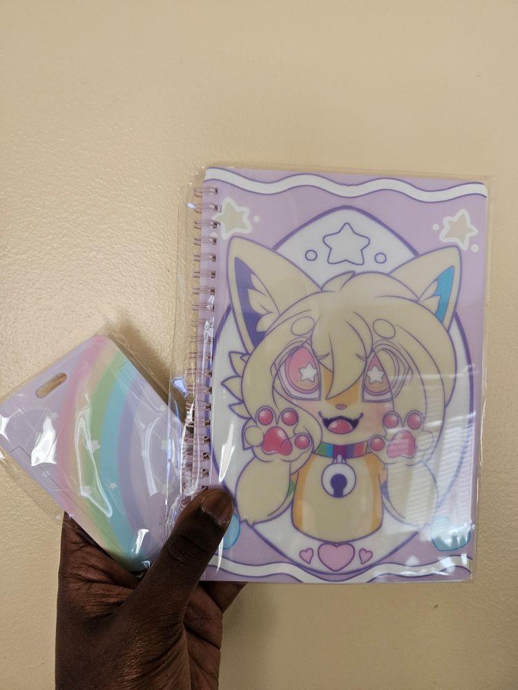 I know what I got!

A Crayons 'n' Things sticker book
A rainbow themed cardholder