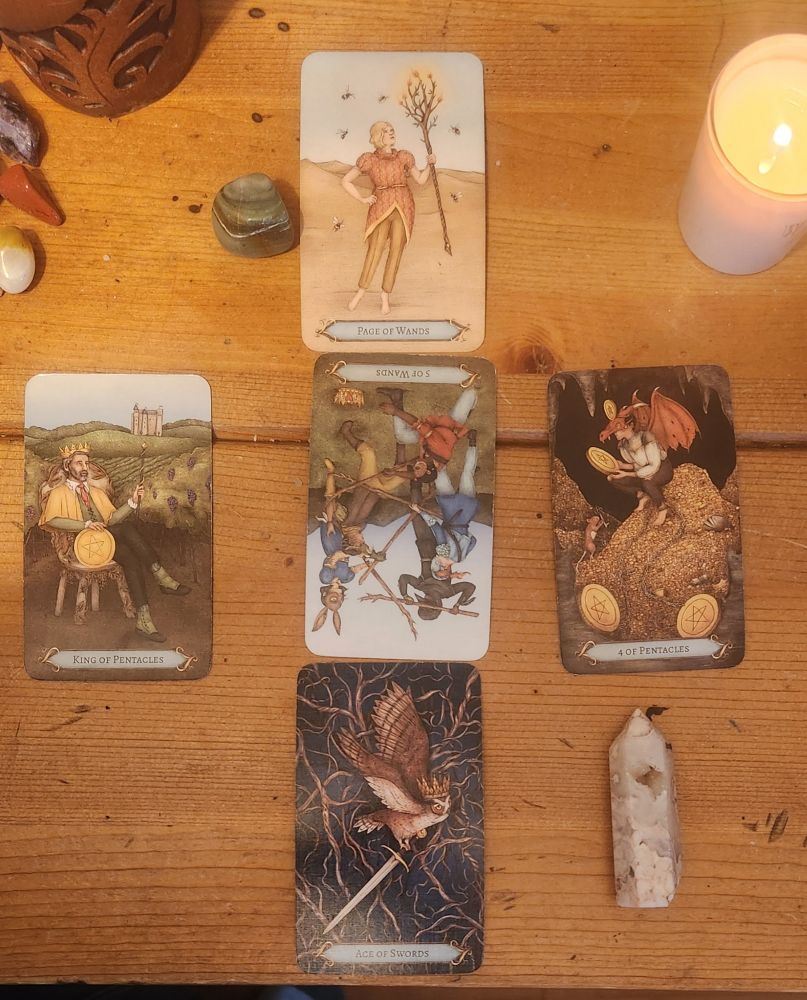 The Good Fortune Tarot Deck There was only one reversed card. 1. King of Pentacles 2. Reversed 5 of Wands 3. 4 of Pentacles- I love the imagery of a youth in s dragon costume sitting on a hoard of coins. 4. Ace of Swords 5. Page of Wands 