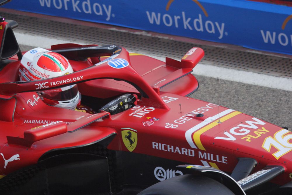 Close-up of Charles Leclerc in the cockpit of his Ferrari SF-24 in the pit-lane exit at Imola.