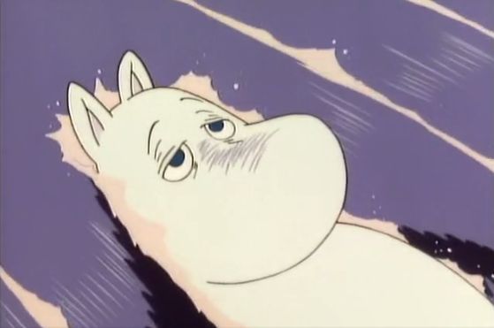 A moomin lying wearily in flowing water