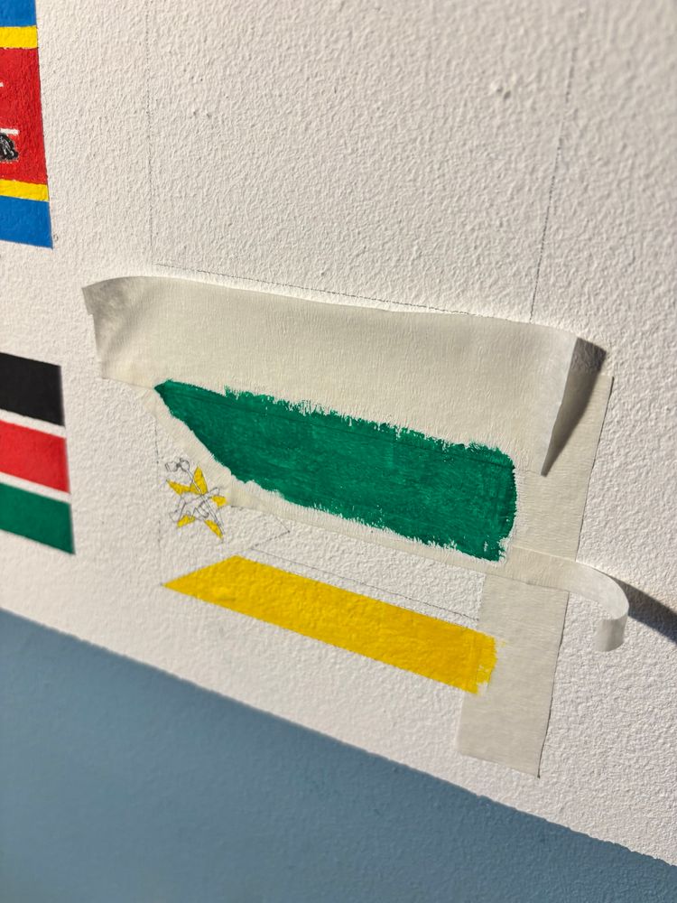 The yellow and green bits of the flag of Mozambique painted in