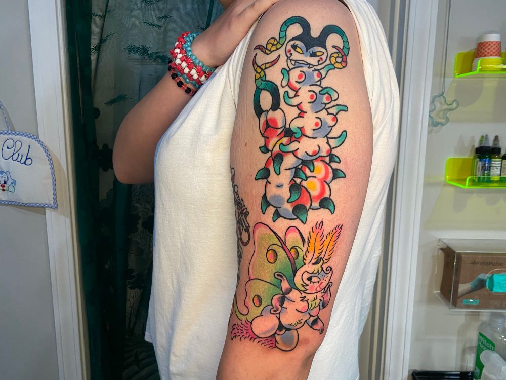 A zoom out of my clients arm showing both the hot centipede girl with eight tits and a little thong on her centipede butt. One month healed. Under her is the luna month from the previous photos 