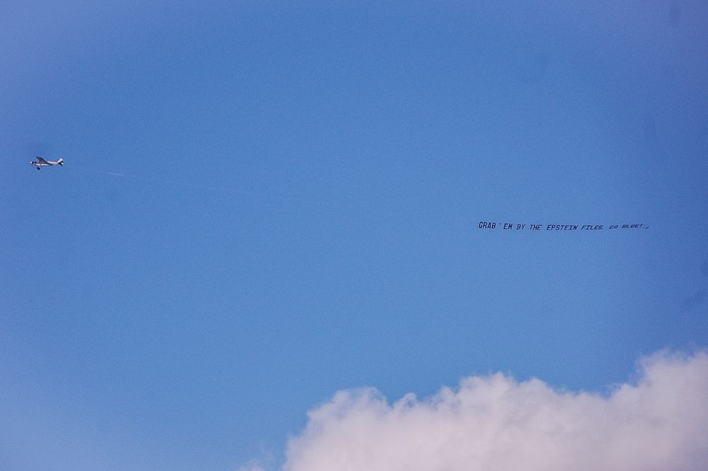 aerial banner flying over University of Michig