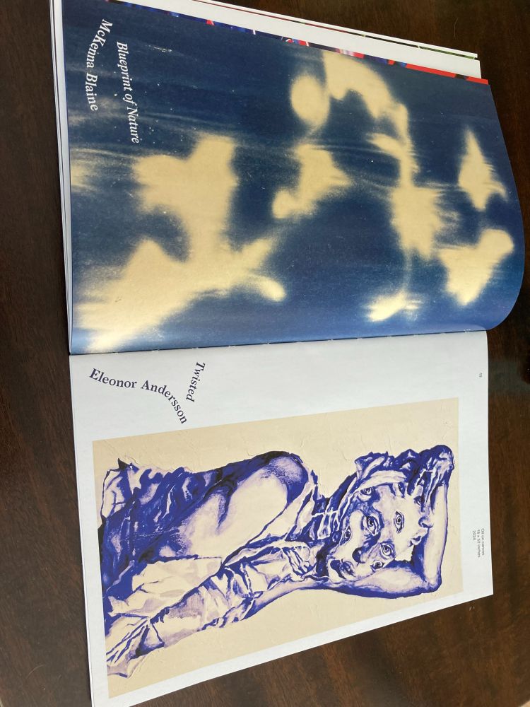 An art spread included inside the magazine. On the left page is an eerie blurred cyanotype of what looks like flowers, with the title "Blueprint of Nature" by McKenna Blaine. On the right side is a surreal image of a person in bluish purple holding a distorted face with eyes all over it. The title is "Twisted" by Eleonor Andersson.