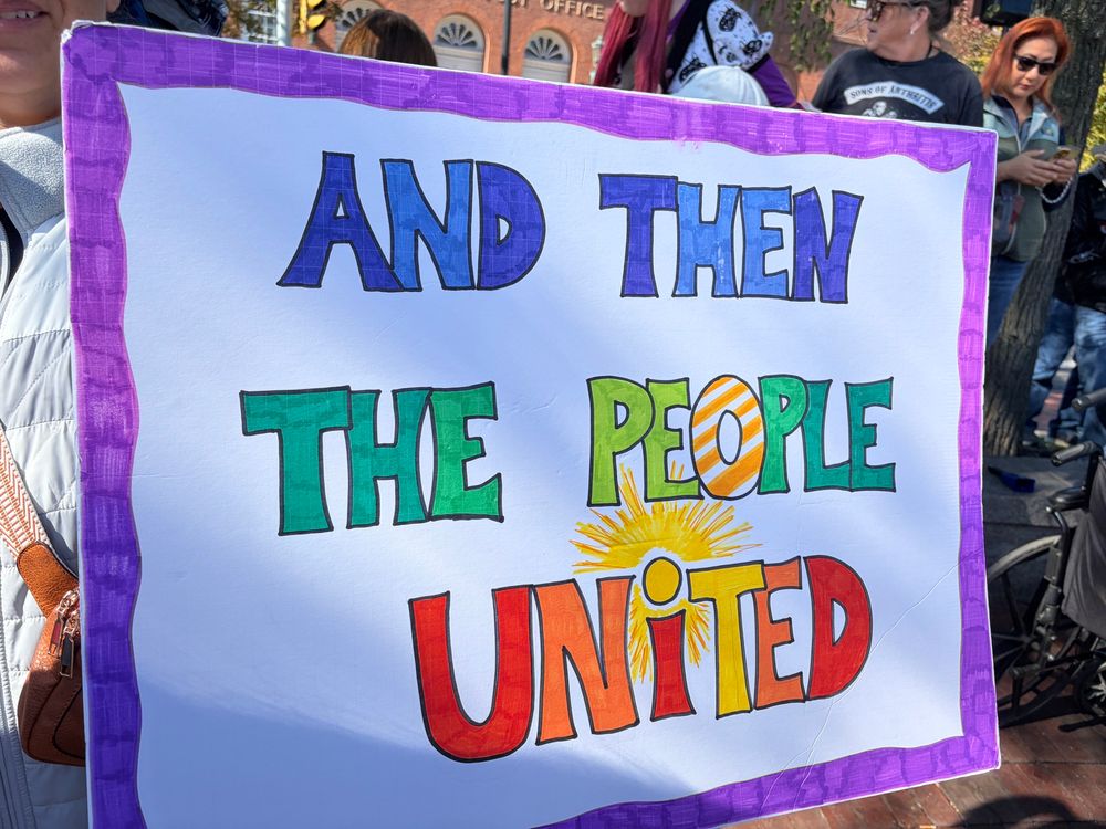 “And then the people united” written in brightly colored block letters 