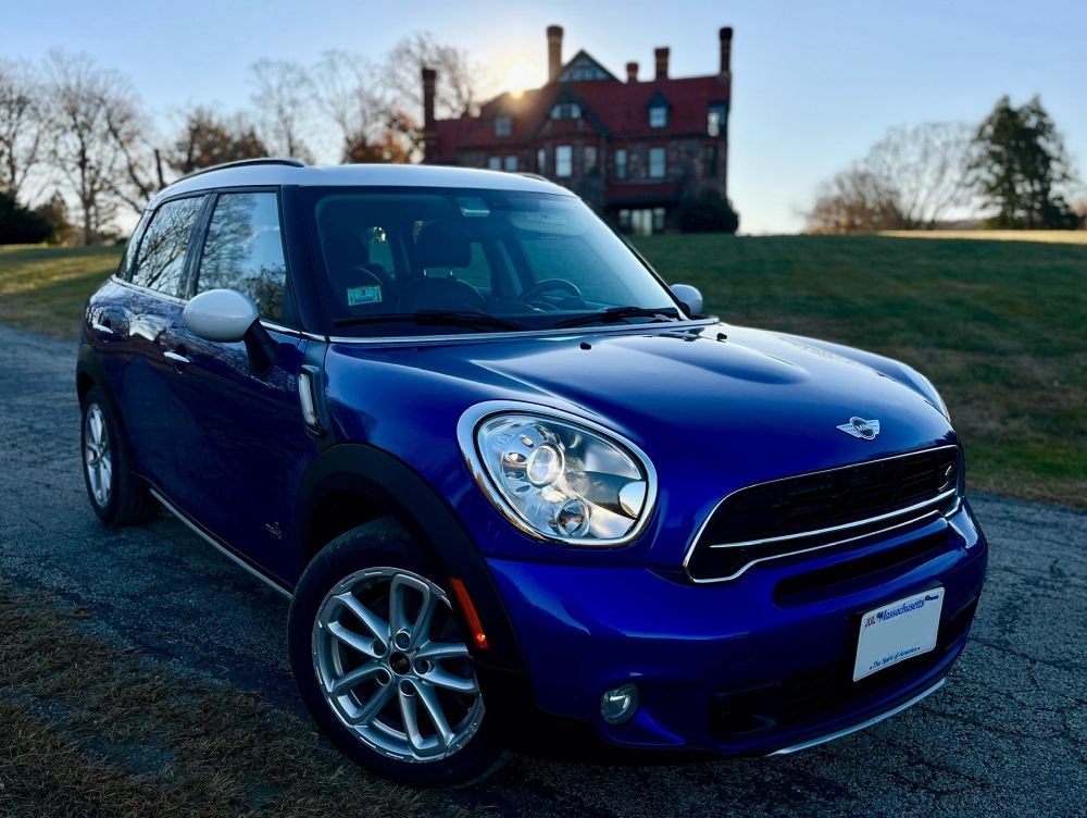 exterior early morning left front quarter shot of blue MINI ALL4 in front of the Eustis mansion