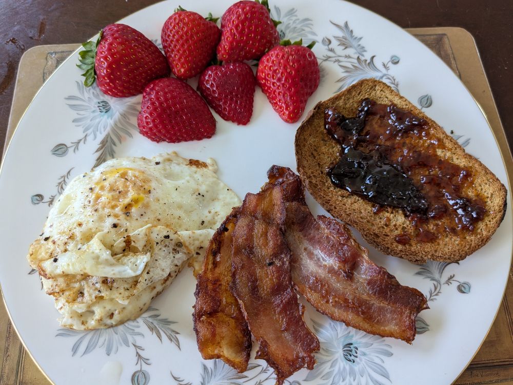 Bacon, eggs, strawberries, brown bread & homemade conserve.
