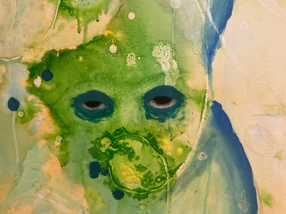 A close up of a painting with no other facial features but eyes