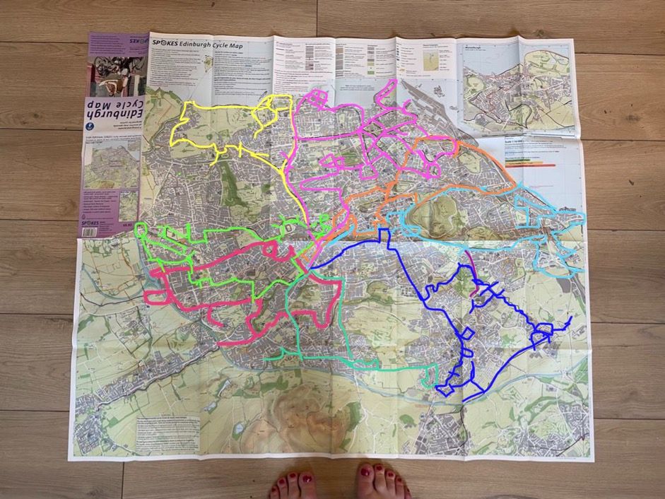 A map of the city of Edinburgh with eight different-coloured loops overlaid on top.  between them, the loops cover pretty much every corner of the city - where there is no coloured marking, that means there is no dedicated cycle path. The loops are extremely wiggly with lots of doubling-back and dead-ends branching off them.