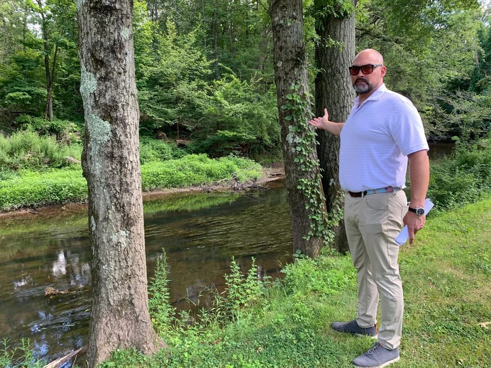 David Jorgenson standing near the Park River in Hartford claiming to care about flooding