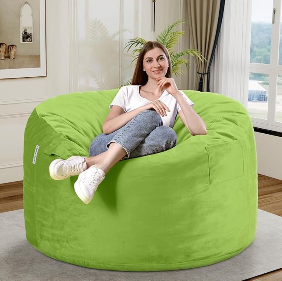a large green bean bag with a photoshopped woman on top