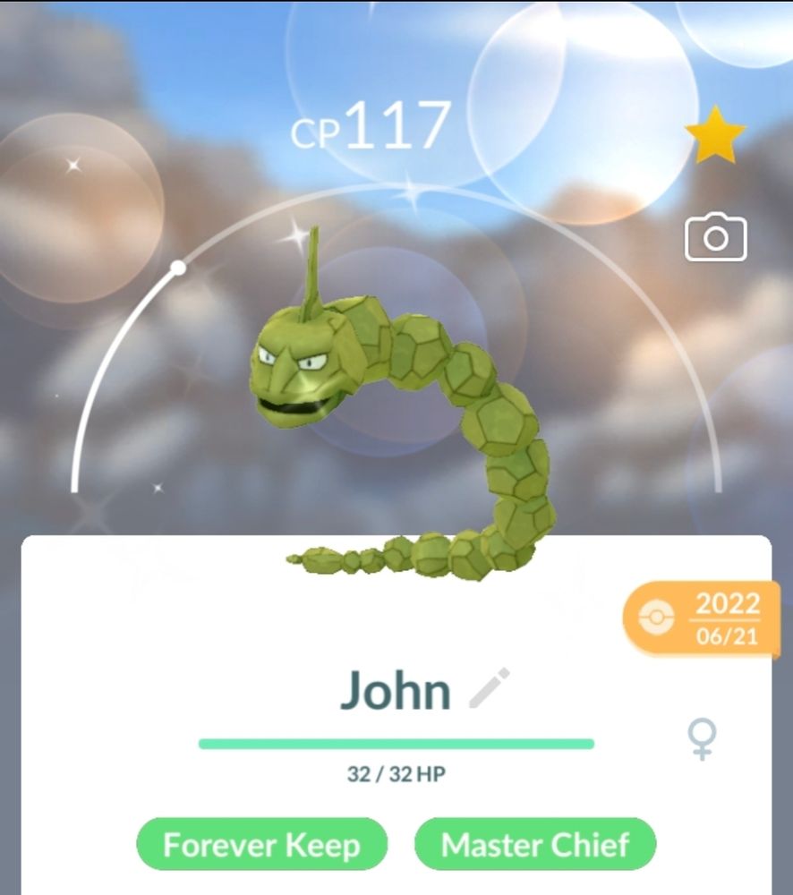 An Onix Pokémon (Rock-Type) in its shiny form. It has a green colouring and is CP 117.