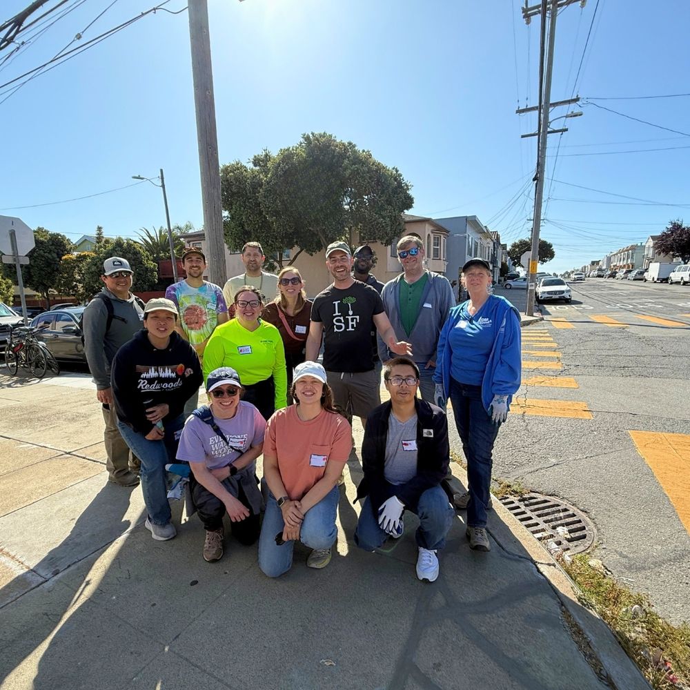 A group photo of 13 people.
