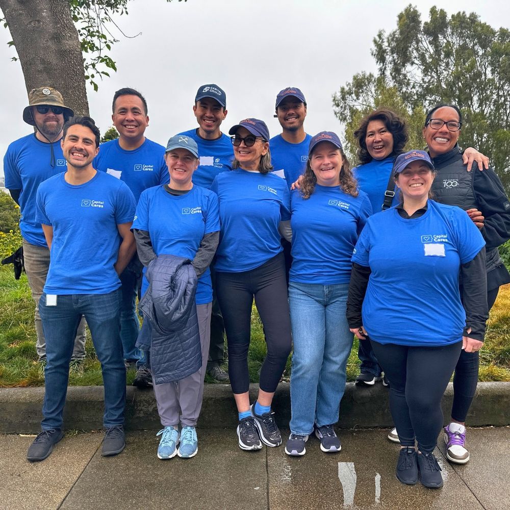 A group photo of 11 smiling volunteers.
