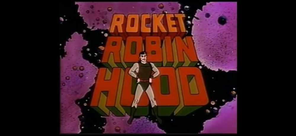 Still image in bright colors and obviously ‘70s animation style. 

A grinning man in a futuristic but simple black bodysuit (with arms and legs uncovered) is standing in front of letters that tower above him. They read “Rocket Robin Hood”