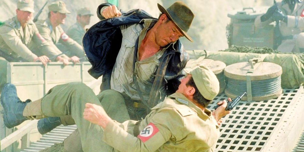 Indiana Jones doing what everyone should do to Nazis.  Punching them until they stop being able to do Nazi stuff to people.