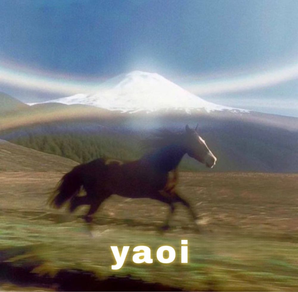 A lone horse runs freely in front of a mountain. Everything is beautiful and bright. Bottom text: “yaoi”