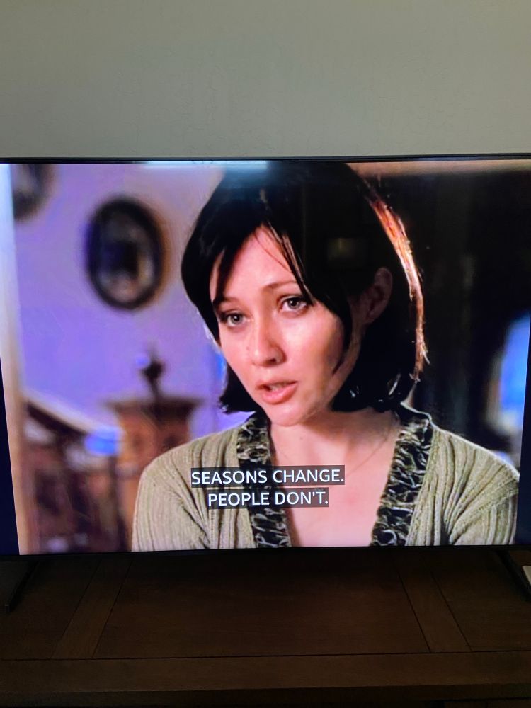 Photo of my TV showing a Charmed moment where Prue says “seasons change, people don’t.”