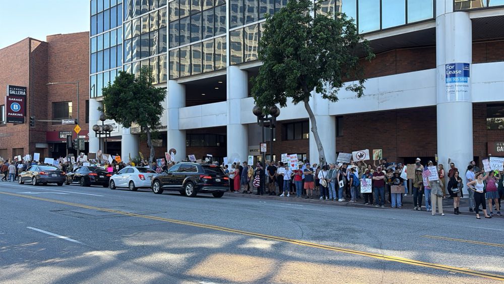Wide shot of peaceful protestors on Broadway in Glendale, CA