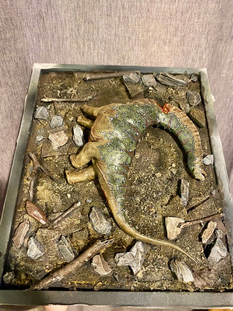 Dead Sauropod model on a rock strewn earthen display base (work in progress) 