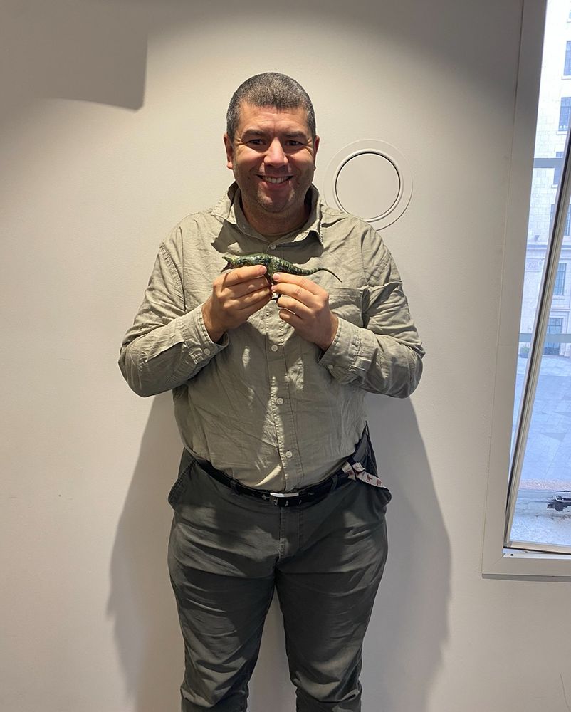 Dave Hone holding a Baryonyx and he’s even happier now Spurs have won a trophy 