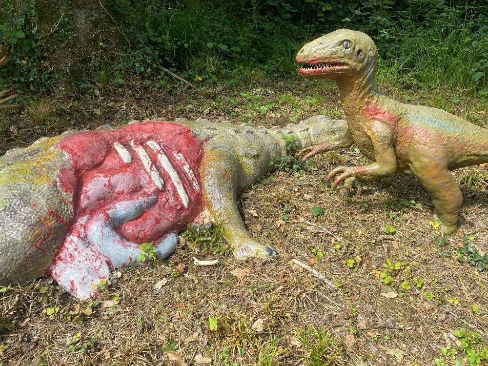 Tiny murderous Dromeosaurs stand over there prey    
