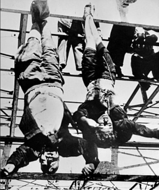 Mussolini hanging by his feet’s