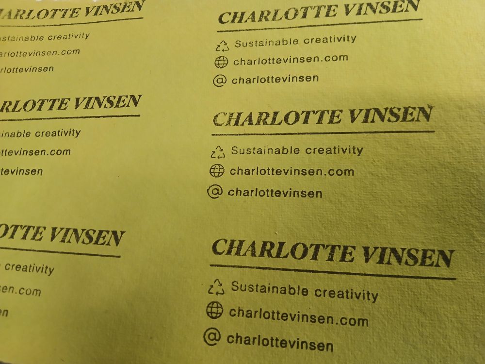 Green textured paper with a repeating stepped design of a business card. Card reads: CHARLOTTE VINSEN sustainable creativity, charlottevinsen.com, @charlottevinsen