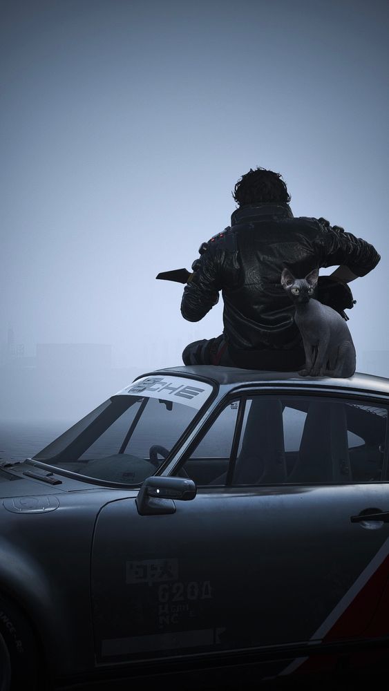 V sits in shadow atop a silver Porsche, with his back to the camera, and Nibbles the cat sitting behind him. Almost silhouetted, V’s messy black hair stands out as he leans forward playing a guitar. 