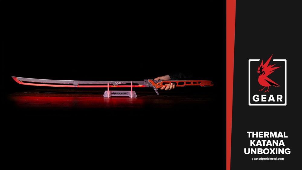 A red thermal katana weapon from Cyberpunk 2077 glows red against a stark black background as a hand grips its hilt. The blade is dark gray along the top and red along the bottom, and sits in a small plastic stand with the Cyberpunk 2077 logo. Text alongside the image reads, “Thermal Katana Unboxing,” printed alongside a link to the CD Projekt Red Gear Store and its logo.

