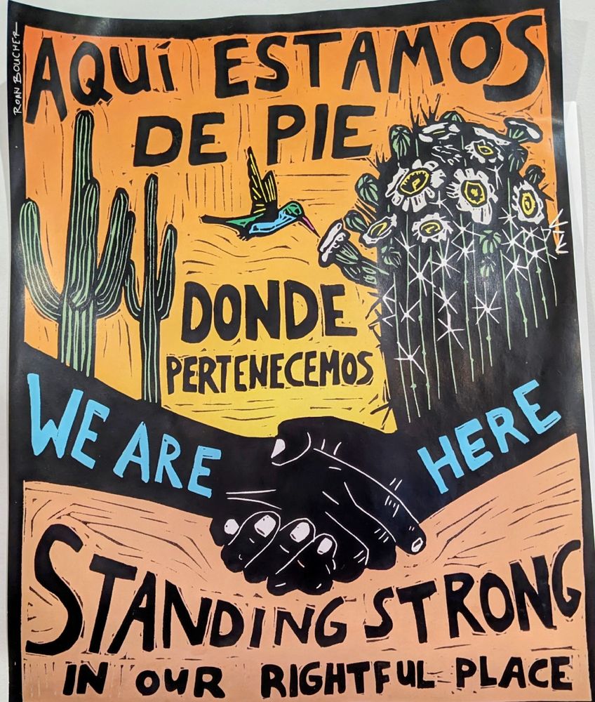 "Aquí estamos de pie donde pertenecemos. 
We are here standing strong in our rightful place."