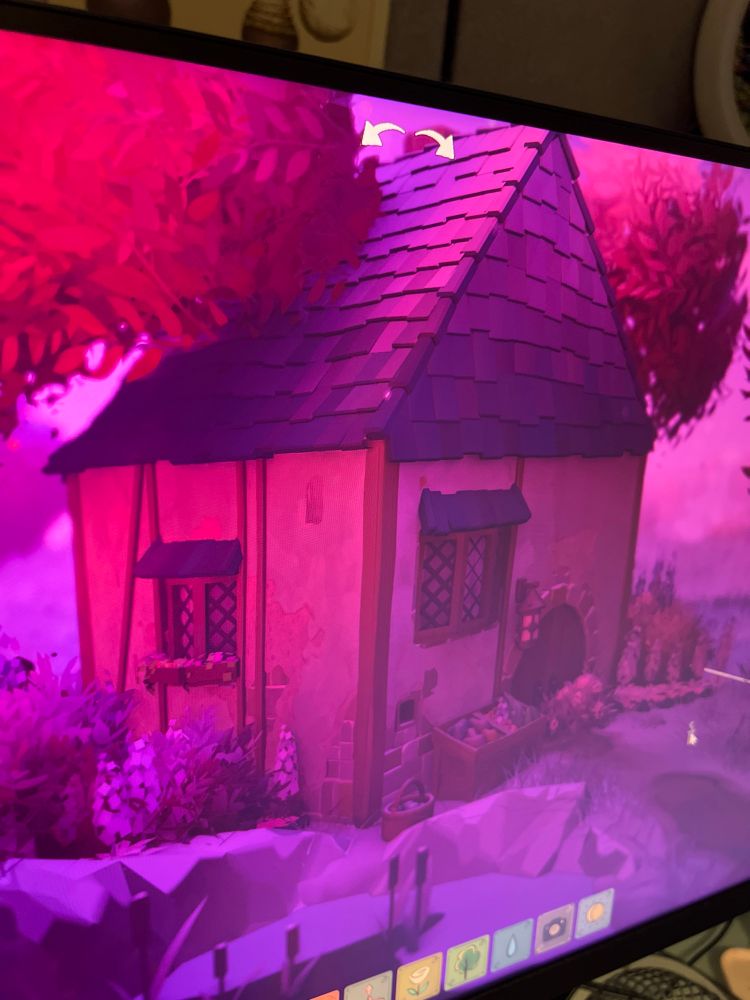 A photo of my screen, pink hues, cottage with a sloped tiled roof and rustic feel. Very sweet. 