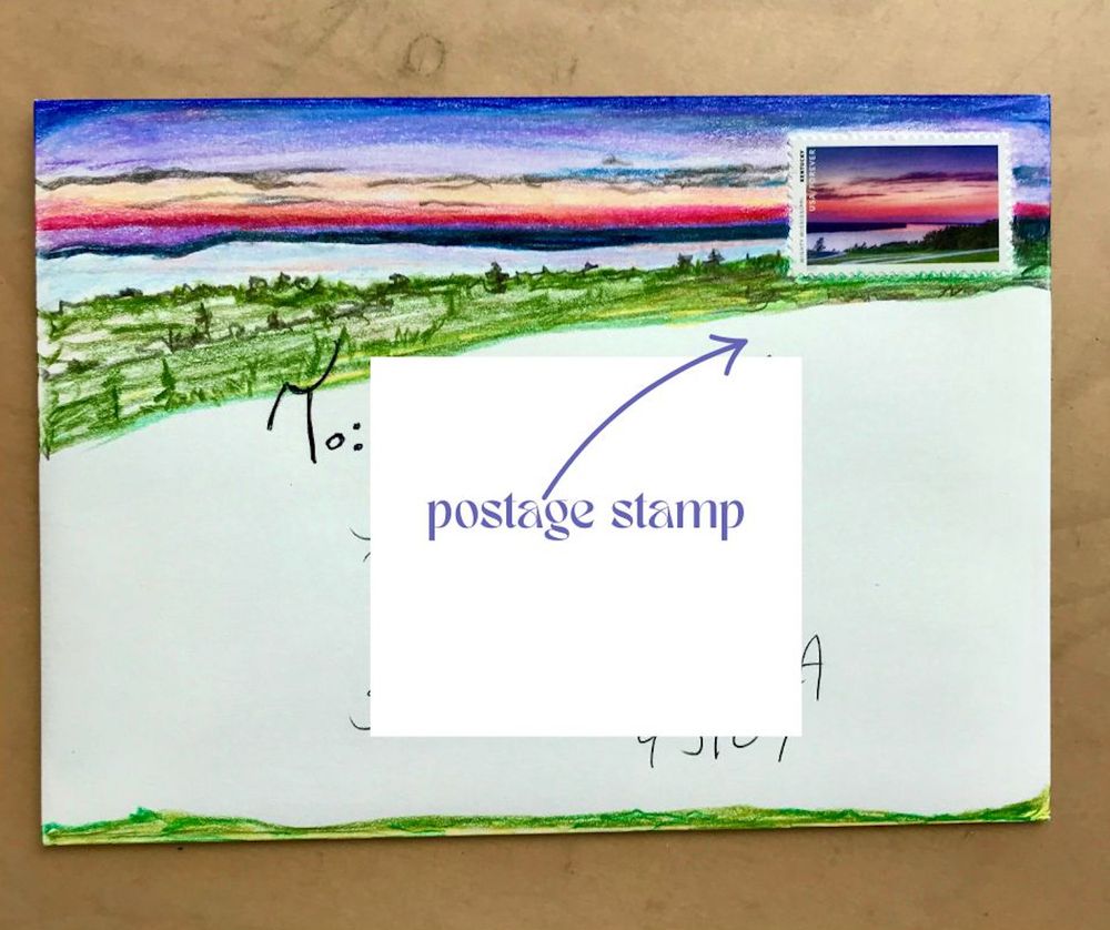 A white envelope with a United States postage stamp in the right corner. The postage stamp image is a body of water with a beautiful sunset of lavender, fuchsia, pink, deep blue and orange. A field of green is below the water. A colored pencil drawing extends the sunset, water and field all the way across the envelope with the same shades as the stamp. It gives the effect that the stamp and colored pencil are all one cohesive piece of art.   