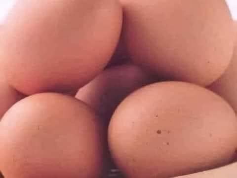 A picture of a bunch of brown eggs that looks like someone is getting pounded
