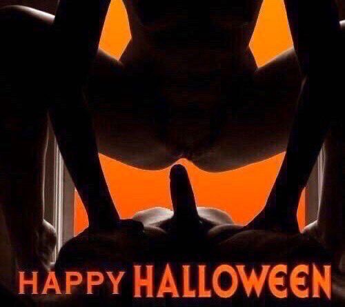 A person about to sit on a dick making a jack o lantern 