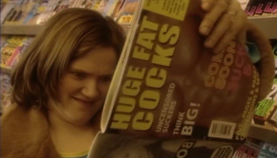 Woman enjoying a magazine called “Huge Fat Cocks”