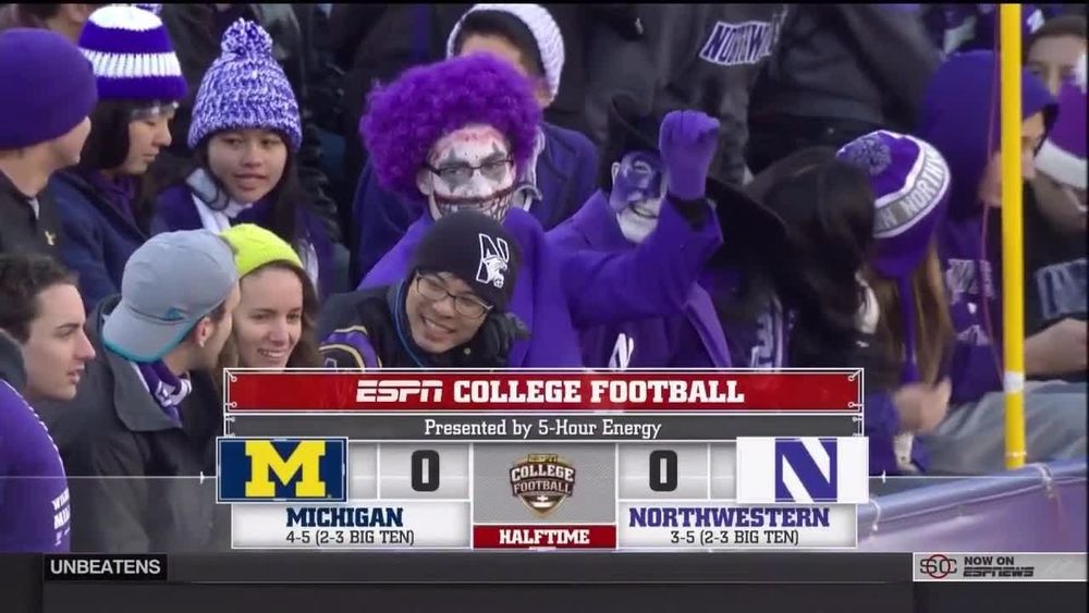 A screenshot from a Michigan @ Northwestern college football game. The score bug is M 0 0 N