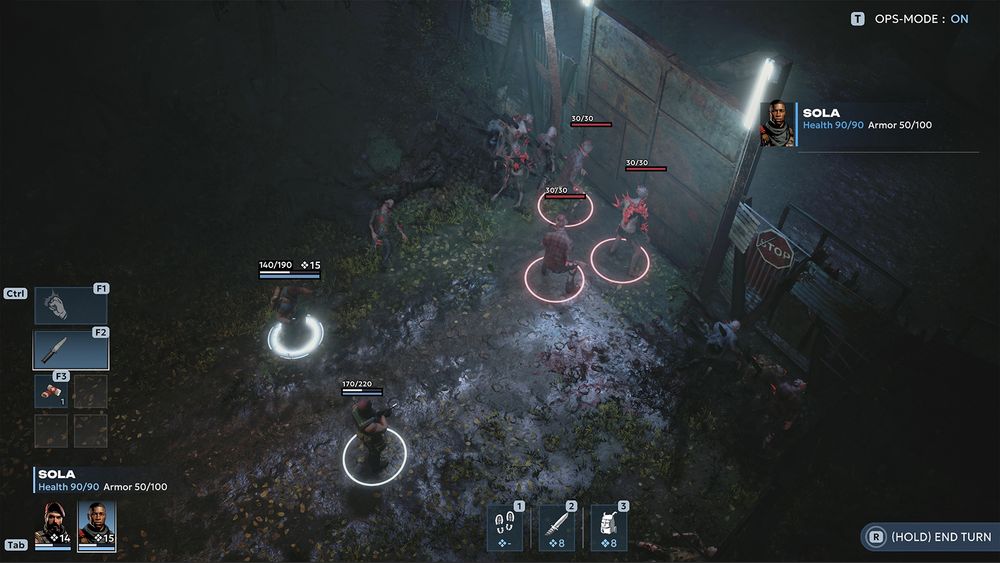 A screenshot of the game showing two characters fighting zombie-like enemies at night with a metal gate and flood lights and UI showing 2 weapons, dialogue and quick-slot healing items. 