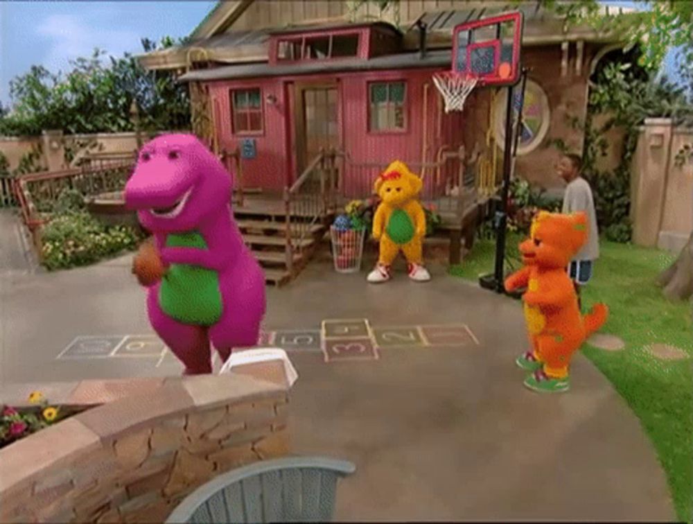 a purple dinosaur is holding a basketball in front of a pink house