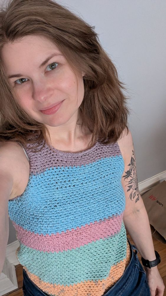 Me, wearing a rainbow tank top. The camera is angled downwards and I'm looking up at it.