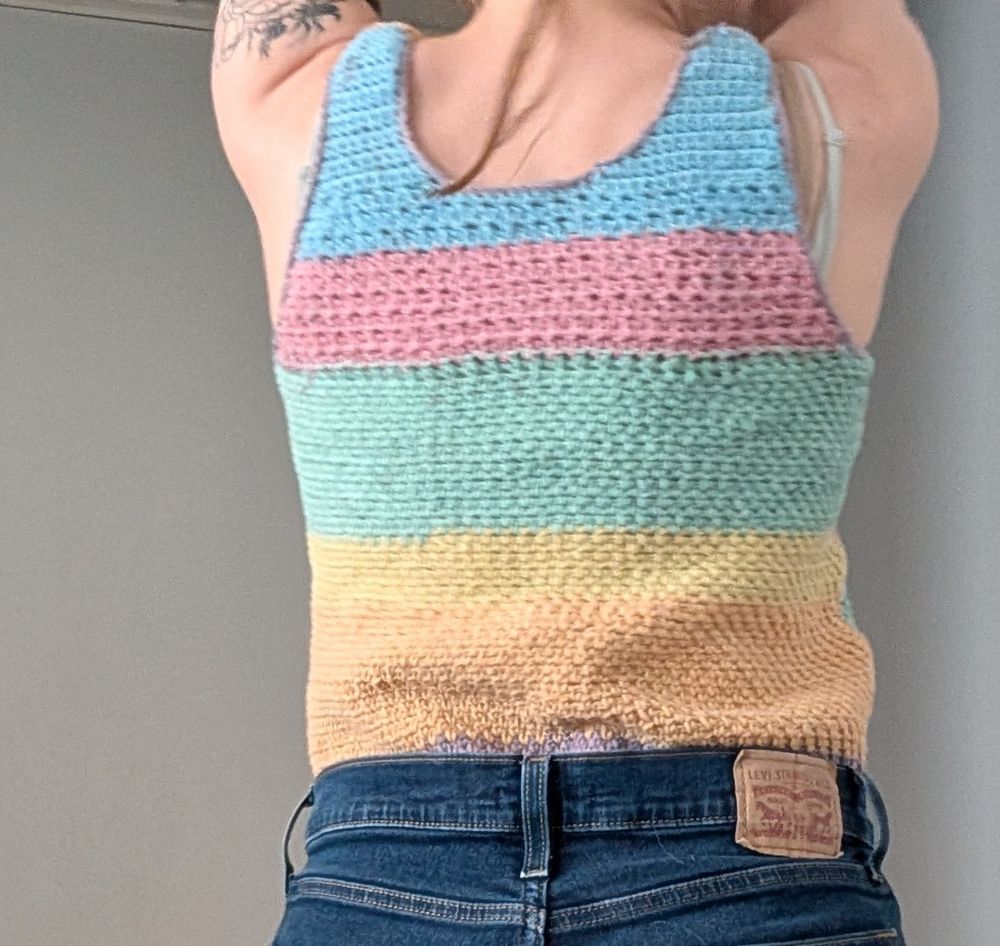 The back of the rainbow tank top featuring blue, pink, green, yellow and orange.