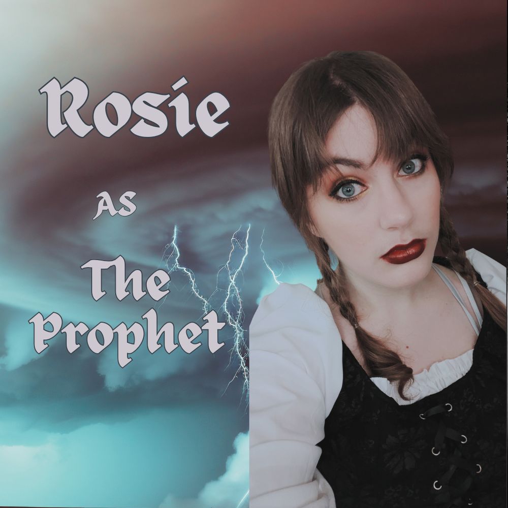 An image presenting Rosie as the new Prophet in our show, Inferno.  She is described within as 'Rosie aims to bring curiosity, enthusiasm, energy, and a bit of clever craftiness to every table she plays at! She is a regular cast member on the Tabletop Talespinners Network, as well as on other channels in the community.’