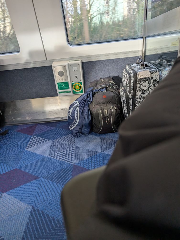 Wheelchair space with luggage in it