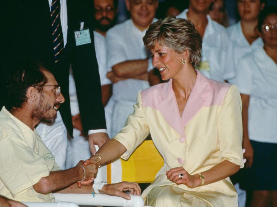 A picture of Diana shaking the hand of a man with AIDS. Note: This was not the original image that made headlines, but another occasion some years later. Her support of people with AIDS was long term. She was Patron of the National AIDS Trust, one of the few charities she maintained relationships with after her divorce. 