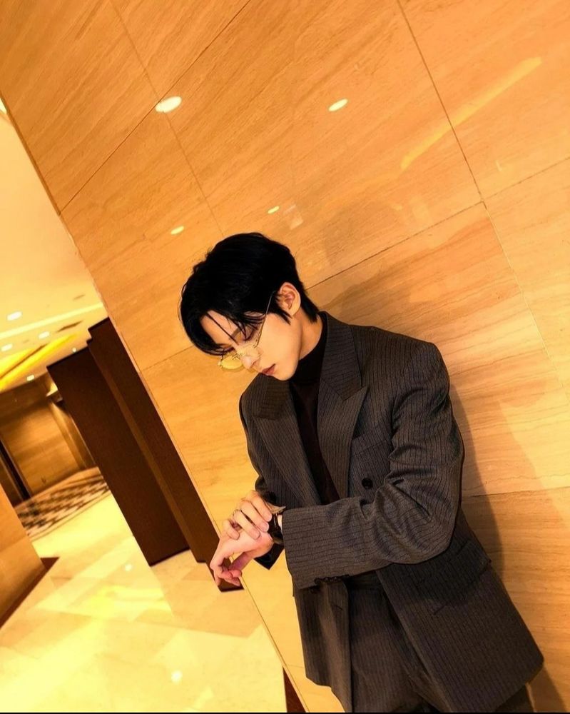 Yunho of Ateez checking watch