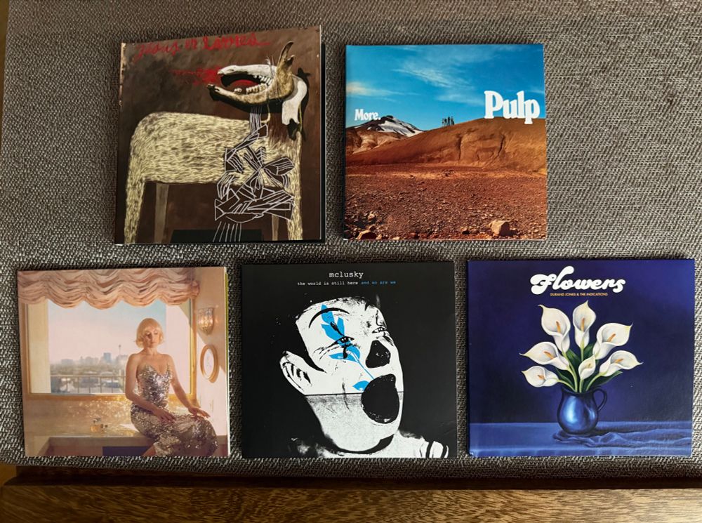 Compact discs of 2025 new releases. Top row (L-R): Alan Sparhawk, Pulp. Bottom row (L-R) Gwenno, mclusky, Durand Jones and the Indications.