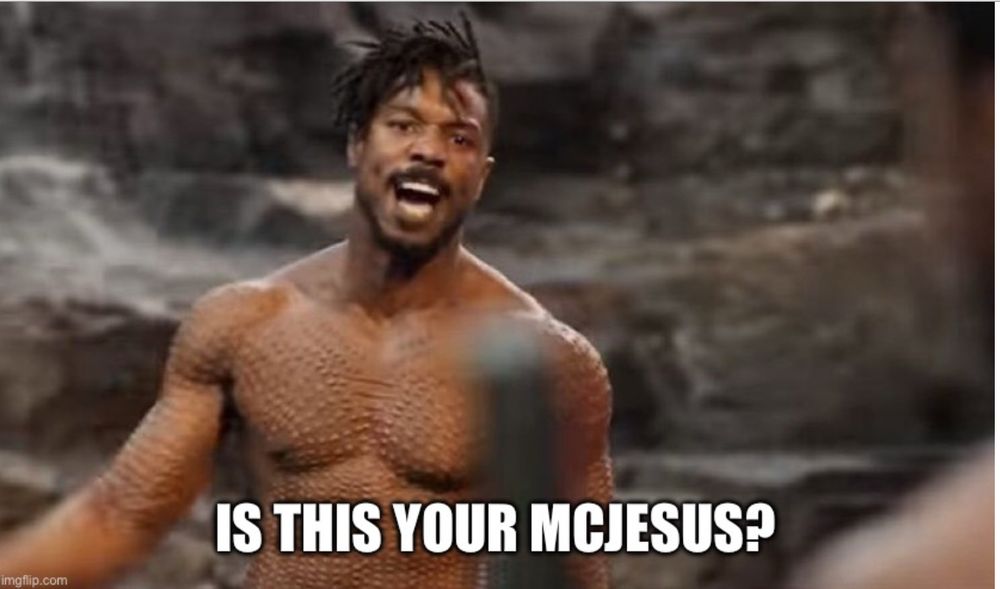 Image of Killmonger from Black Panther in the scene when he’s fighting T’Challa and says, “is this your king?” But in this version it’s changed to say, “is this your McJesus?”