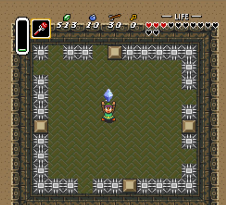 Screenshot of The Legend of Zelda : A Link ot the Past.

Link just defeated the moth boss of Skull Dungeon, and is holding a crystal dropped by the boss after its death.